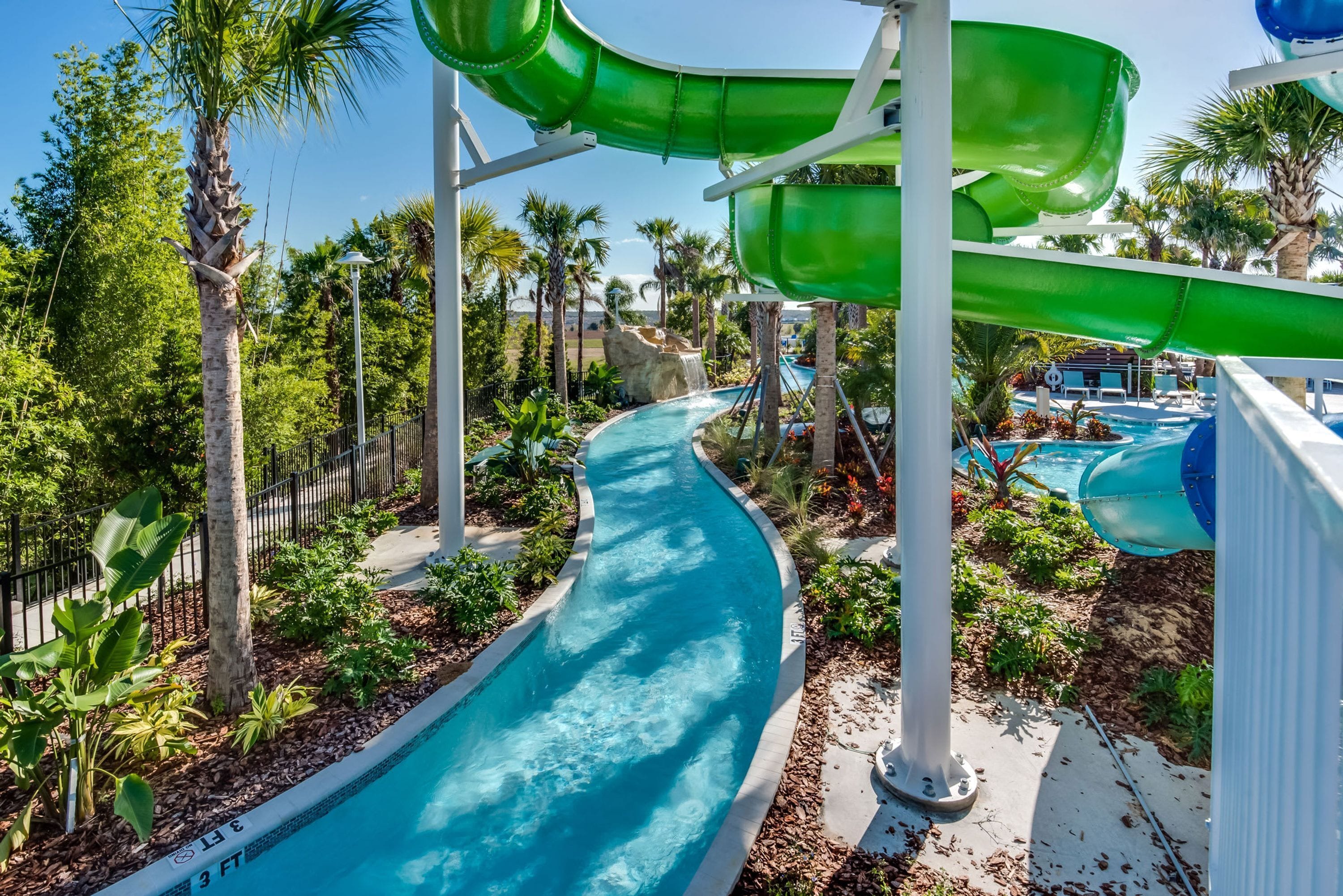 A water park with multiple slides and a pool.