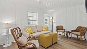 A modern living room with a sofa, two armchairs, a coffee table, and a lamp. - Sunny 3BR Near the Beach at Palm Court  (#17) (North Myrtle Beach)