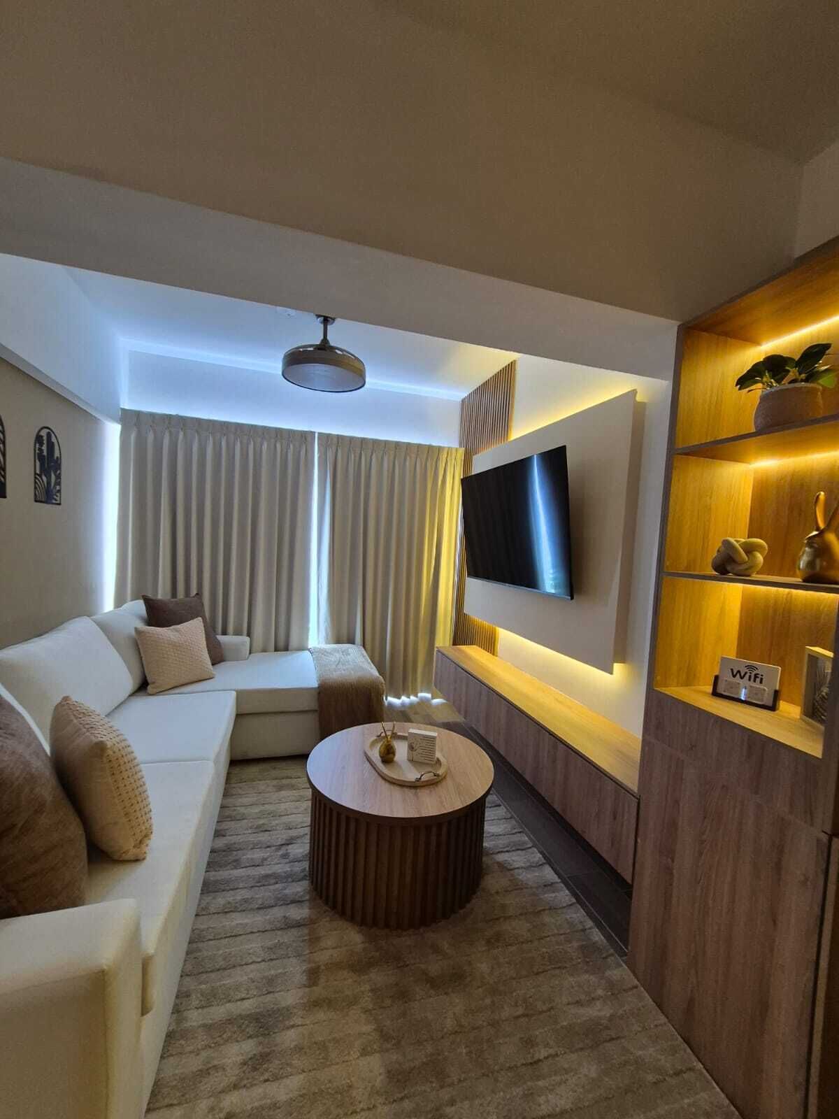 Family Apartment, City View | Living area | 60-inch LED TV with cable channels
