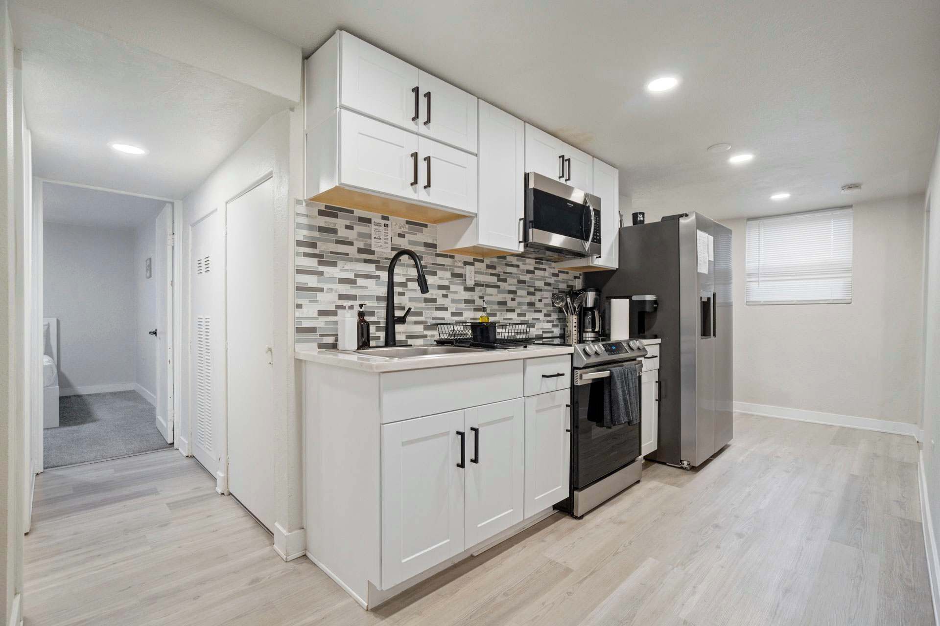 Fridge, microwave, stovetop, coffee/tea maker