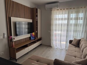 Superior Apartment, City View | Living area | TV - Blue Studios By Comfort Suites (Golem)