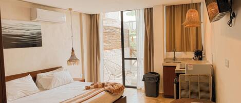 Suíte estúdio conforto, sacada, vista para o jardim | Wi-Fi de cortesia