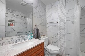 Hair dryer, towels, soap, toilet paper