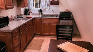 Fridge, microwave, stovetop, coffee/tea maker