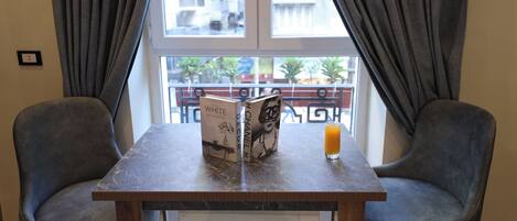 Deluxe Double Room, City View | In-room dining