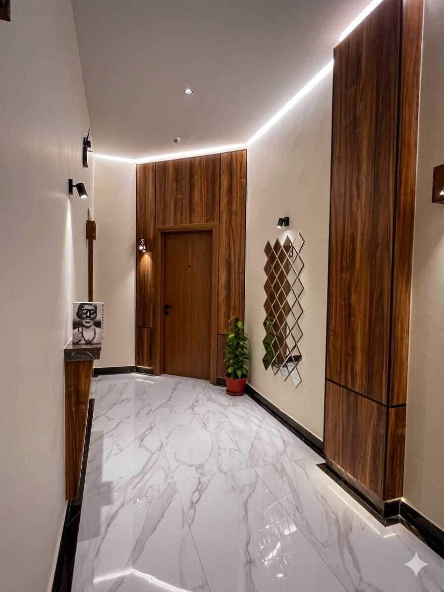 A hallway with a wooden door, a potted plant, and a wall-mounted decorative piece.