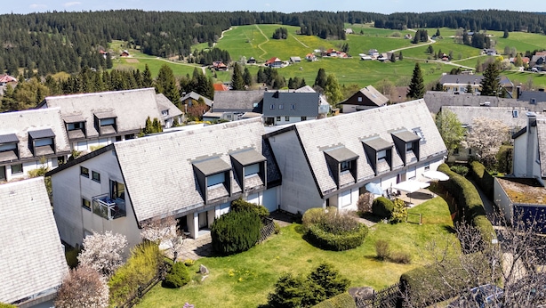 A residential area with modern houses, a green landscape, and a clear sky. - FE-WO Paradiso, 78141 Schönwald in the Black Forest With swimming pool and sauna 1000m.a.s.l. (Schönwald im Schwarzwald)