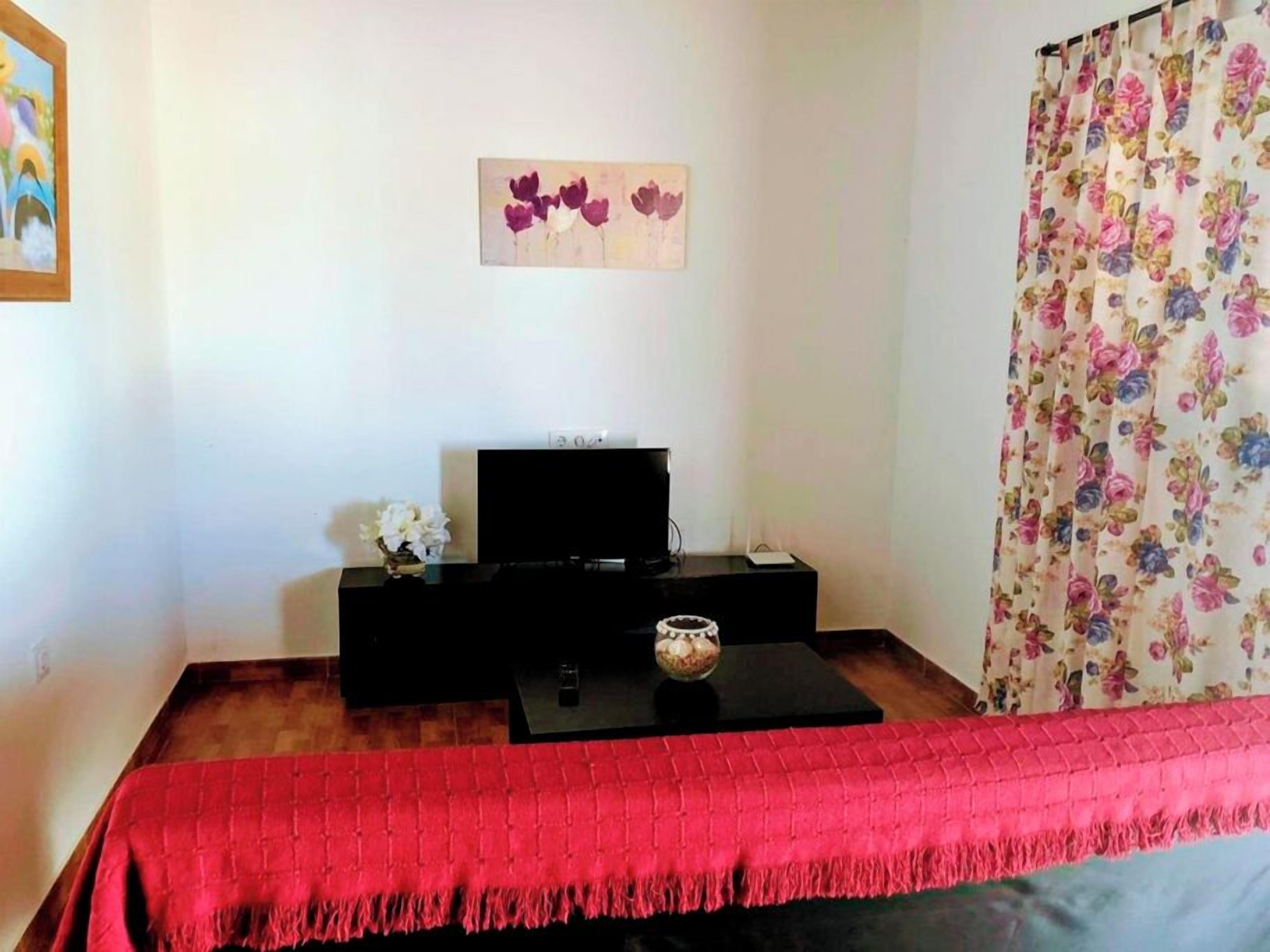 Comfort Chalet, Patio, Garden View | Living area | 42-inch flat-screen TV with cable channels