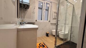 Shower, bidet, towels, soap