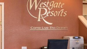 A reception desk at Westgate Resorts with a sign that reads "Come Live The Dream."
