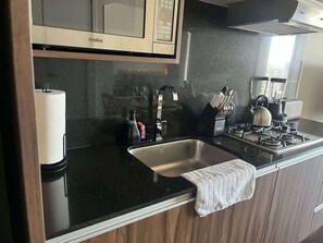 Microwave, stovetop, toaster, cookware/dishes/utensils