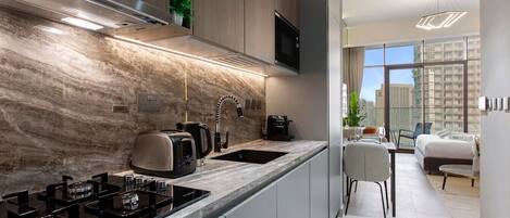 Fridge, microwave, stovetop, coffee/tea maker