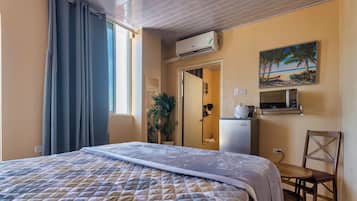 Comfort Room, 1 Bedroom, Sea View | In-room safe, desk, iron/ironing board, free WiFi