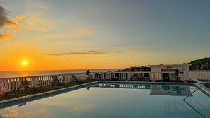 2 outdoor pools, pool umbrellas, pool loungers