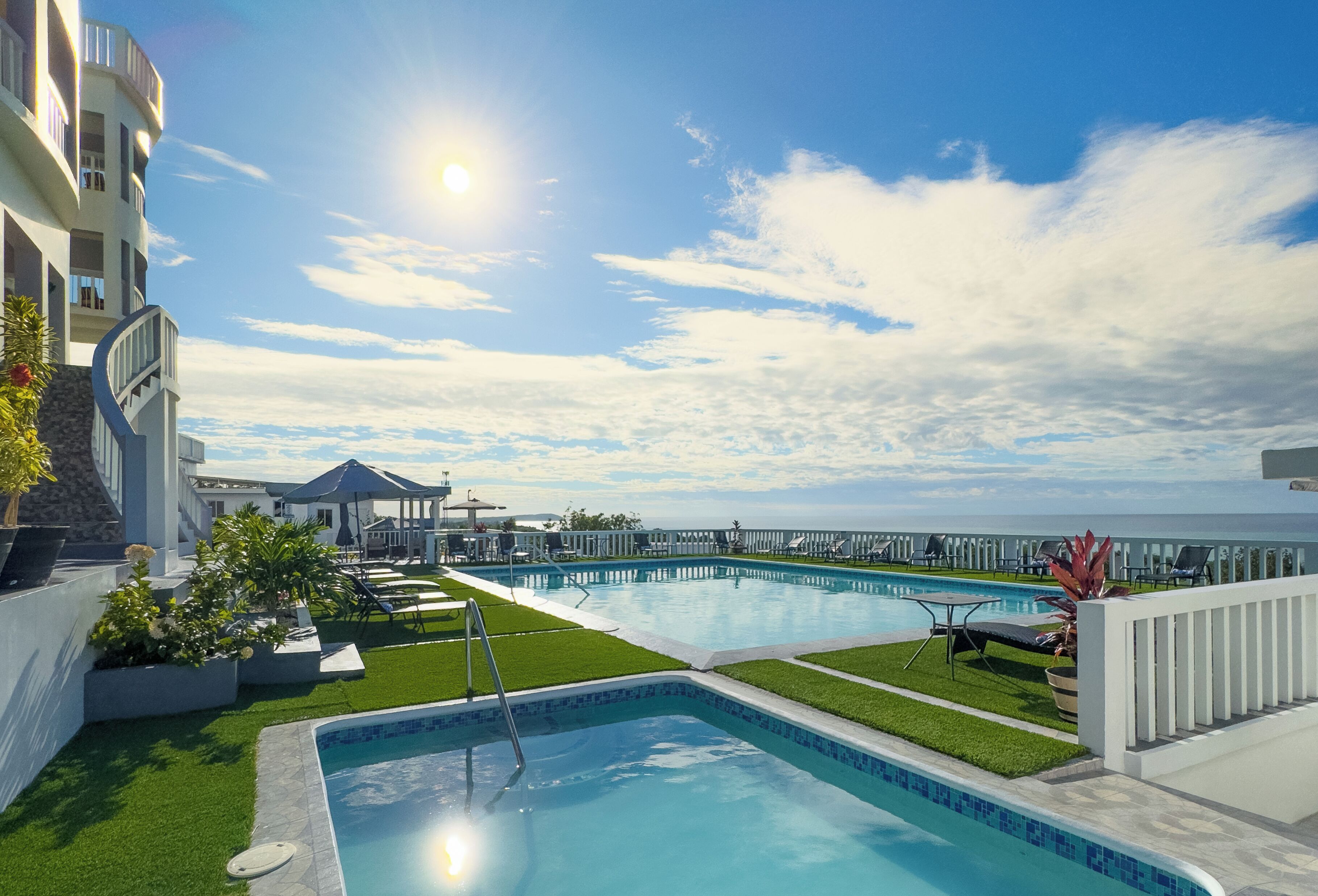 2 outdoor pools, pool umbrellas, pool loungers