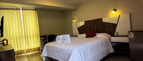 Deluxe Room, Garden View | Down comforters, Select Comfort beds, desk, laptop workspace