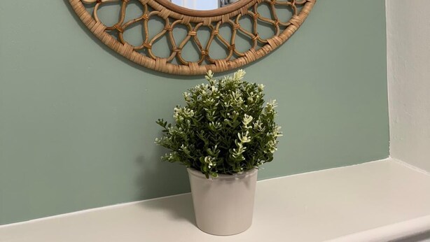 A round mirror with a woven frame on a wall. - School Path in the heart of the historic Ironbridge (Telford)