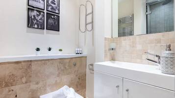 Shower, hair dryer, towels, soap