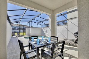 Outdoor dining - Newly Updated 4BR TownHome with Pool at Storey Lake Resort (Kissimmee)