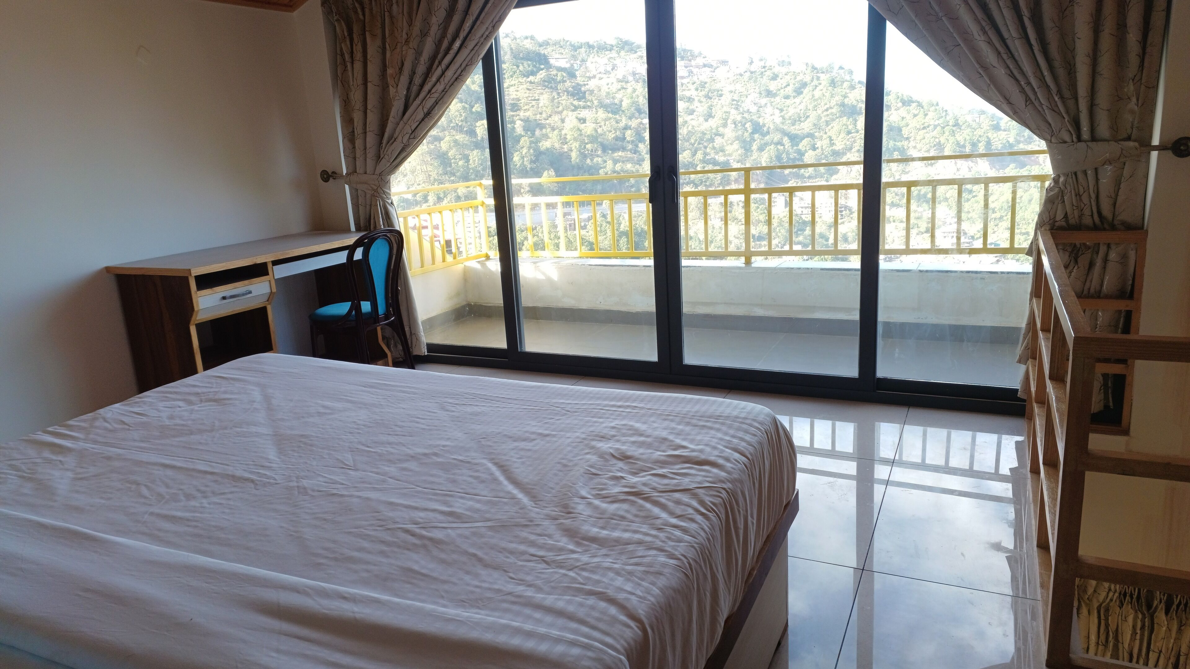 Desk, laptop workspace, blackout curtains, iron/ironing board