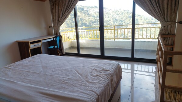 Desk, laptop workspace, blackout curtains, iron/ironing board