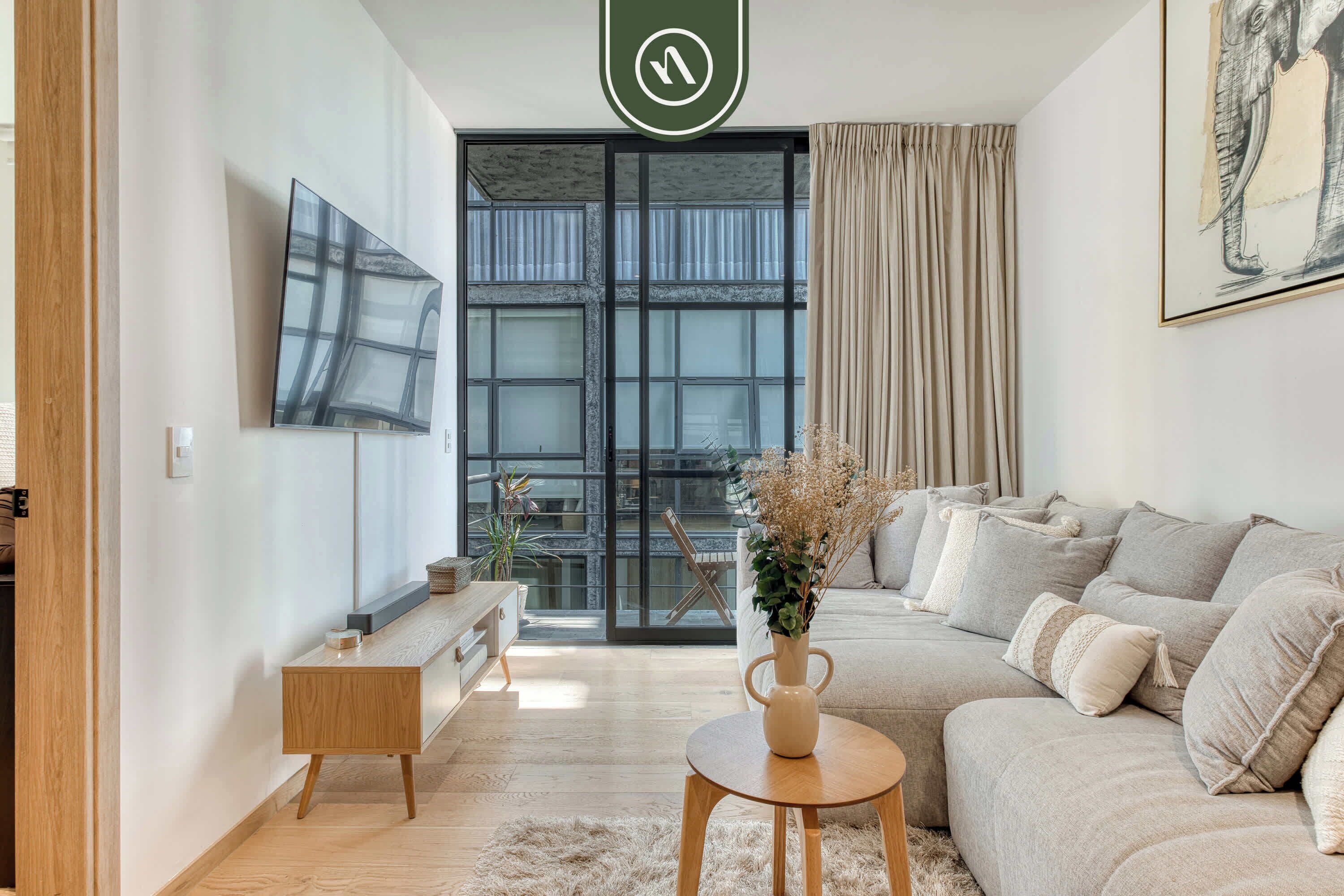 Departamento, varias camas, cocina, vista a la ciudad (Unico Roma Torre Maple 302) | Área de sala de estar