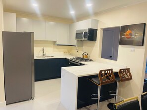 Fridge, microwave, oven, stovetop - Cozy Haven (Portmore)