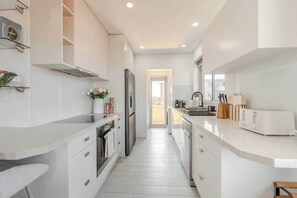 Coffee/tea maker, fridge, microwave, oven
