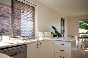 Microwave, oven, stovetop, dishwasher - Lakeside Escape | Waterfront Stay near Burleigh (Varsity Lakes)