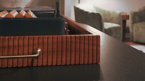 A wooden tray with a plant on a table, a lamp, and a staircase in the background. - Spacious, Sleeps 16+, Game Room Near Downtown Indianapolis (Indianapolis)