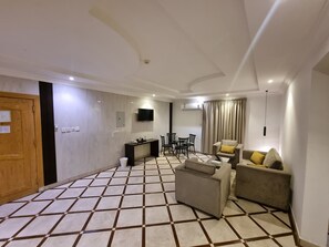 Family Double Room, 2 Bedrooms | Living area | 40-inch LCD TV with satellite channels - Afaq suite Al-massif - افاق سويت المصيف (Riyadh)