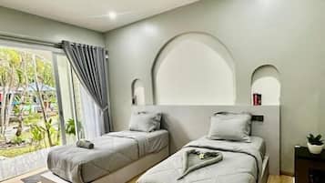 Family Room, 3 Bedrooms, Garden View | Desk, free WiFi