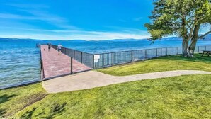 A wooden pier extending into a lake with a clear sky. - Beautiful Tahoe Keys Home: Family and Pet Friendly (South Lake Tahoe)