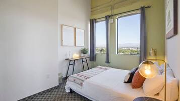 1 bedroom, desk, iron/ironing board, travel crib