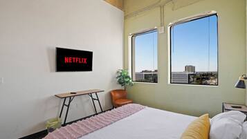 1 bedroom, desk, iron/ironing board, travel crib