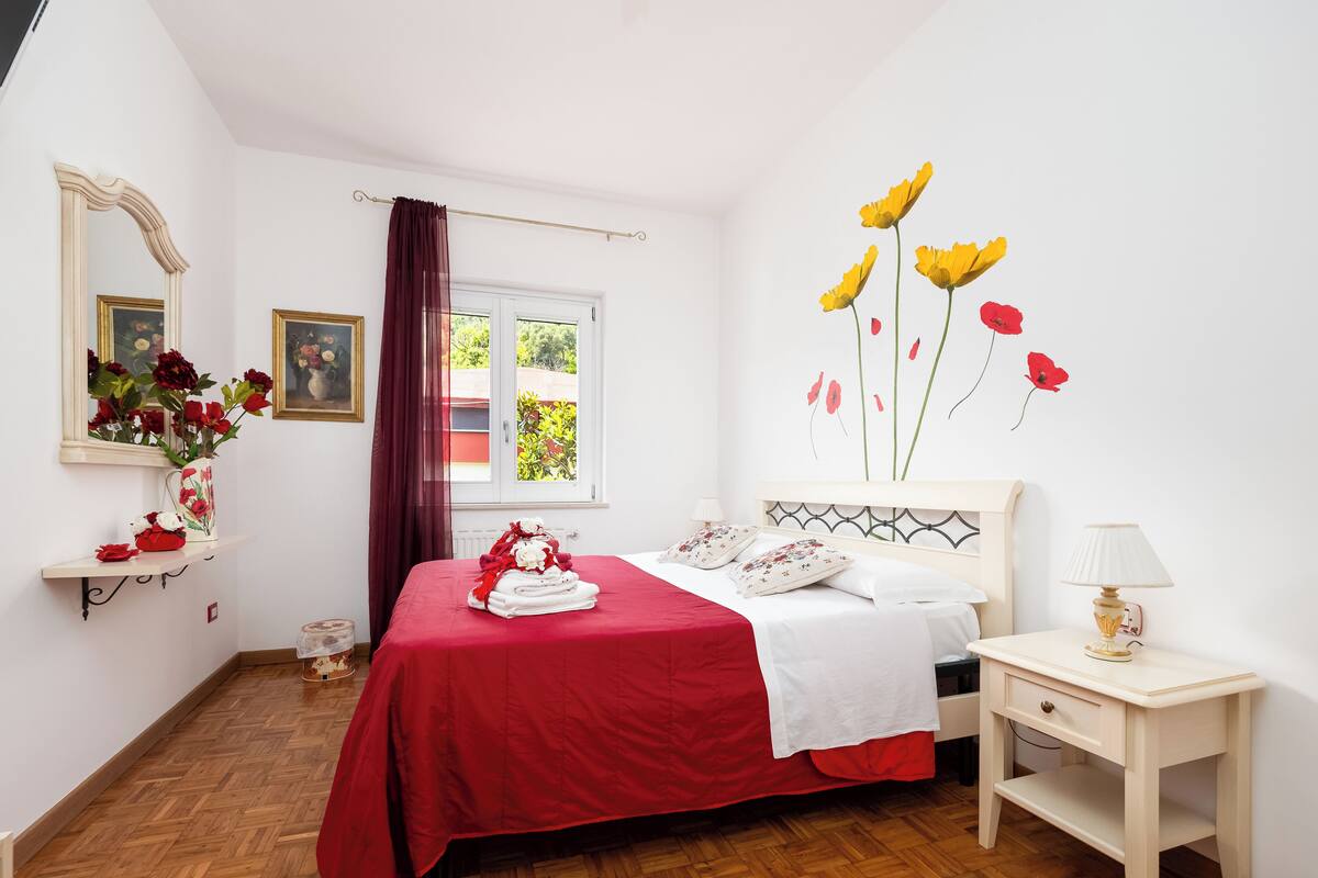 Desk, laptop workspace, blackout drapes, iron/ironing board