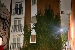 A multi-story building with balconies, a visible address sign, and a satellite dish. - Larches Lane Retreat - Sleeps 5 - Wolverhampton (Wolverhampton)