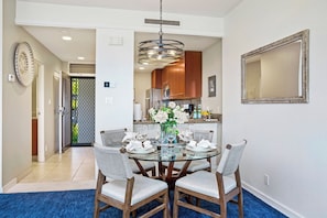 A full dining setup beside the kitchen, perfect for family meals. KGV-20T8 - Kapalua Golf | Golf View 3 BR, Sleeps 9 | Car Incl. w/ 6+ Nights | KGV ML-2189 by KBM (Lahaina)