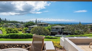 A residential area with houses, a grassy landscape, and a clear sky. - Kapalua Golf | Golf View 3 BR, Sleeps 8 | Car Incl. w/ 6+ Nights | KGV ML-2201 by KBM (Lahaina)