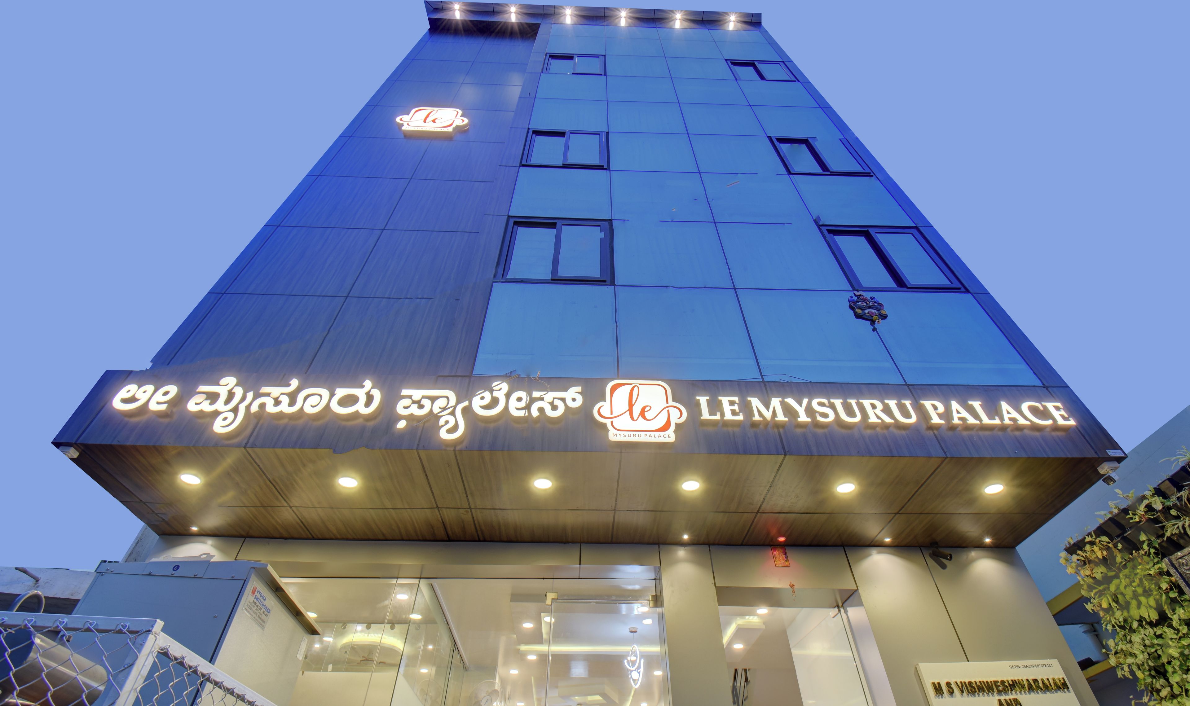 A modern building with a sign reading "Lemysuru Palace."