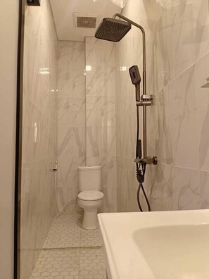 Shower, hair dryer, towels, soap