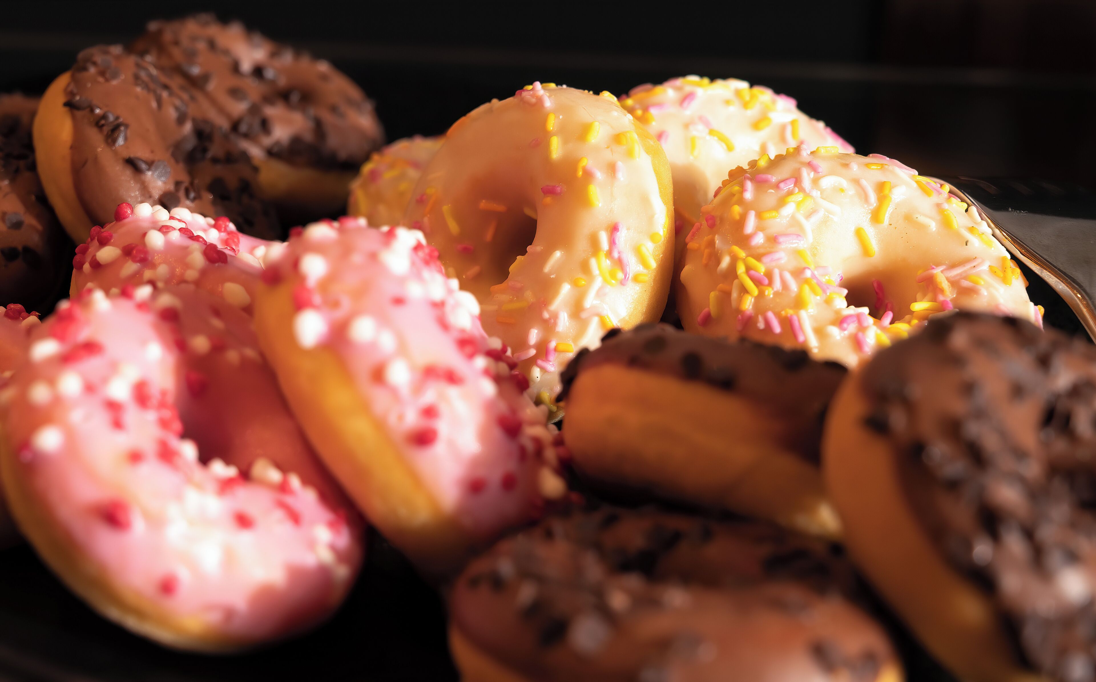 A variety of donuts with different toppings.