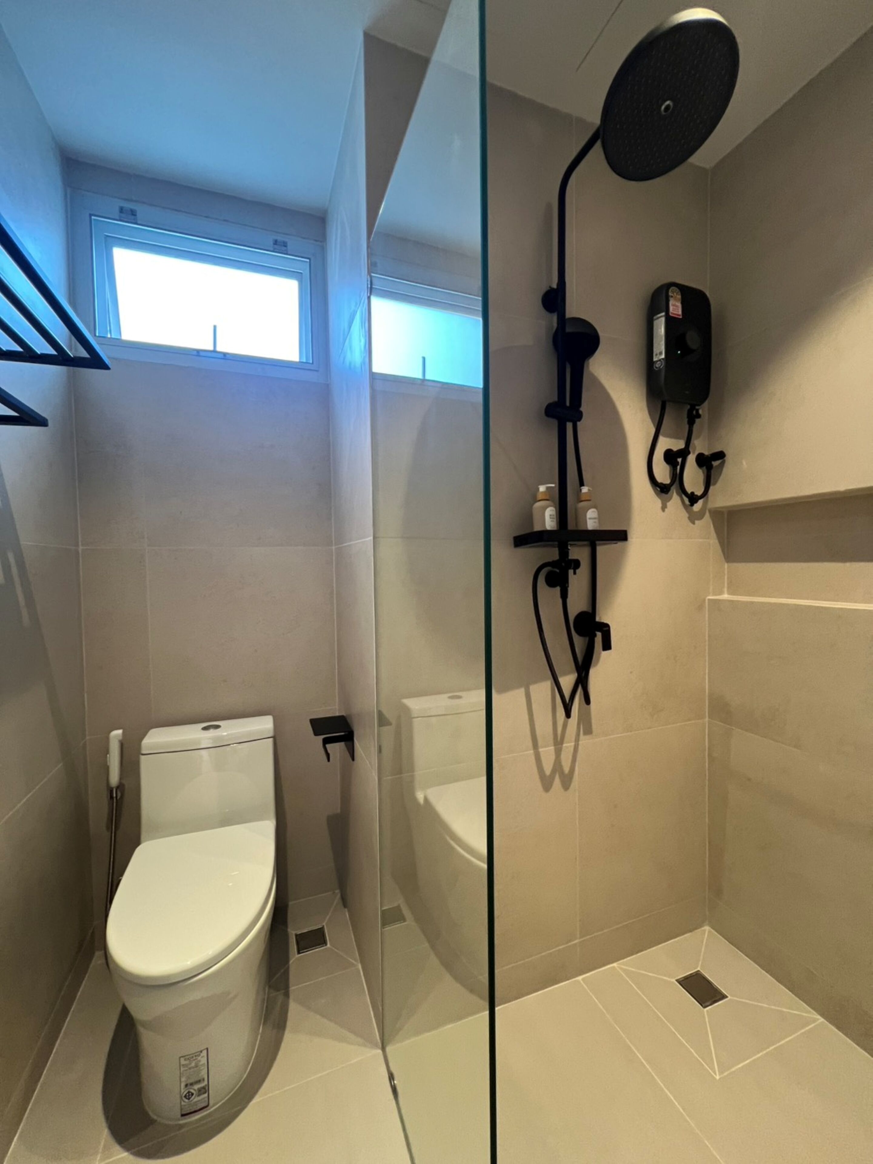 Shower, hair dryer, towels, toilet paper