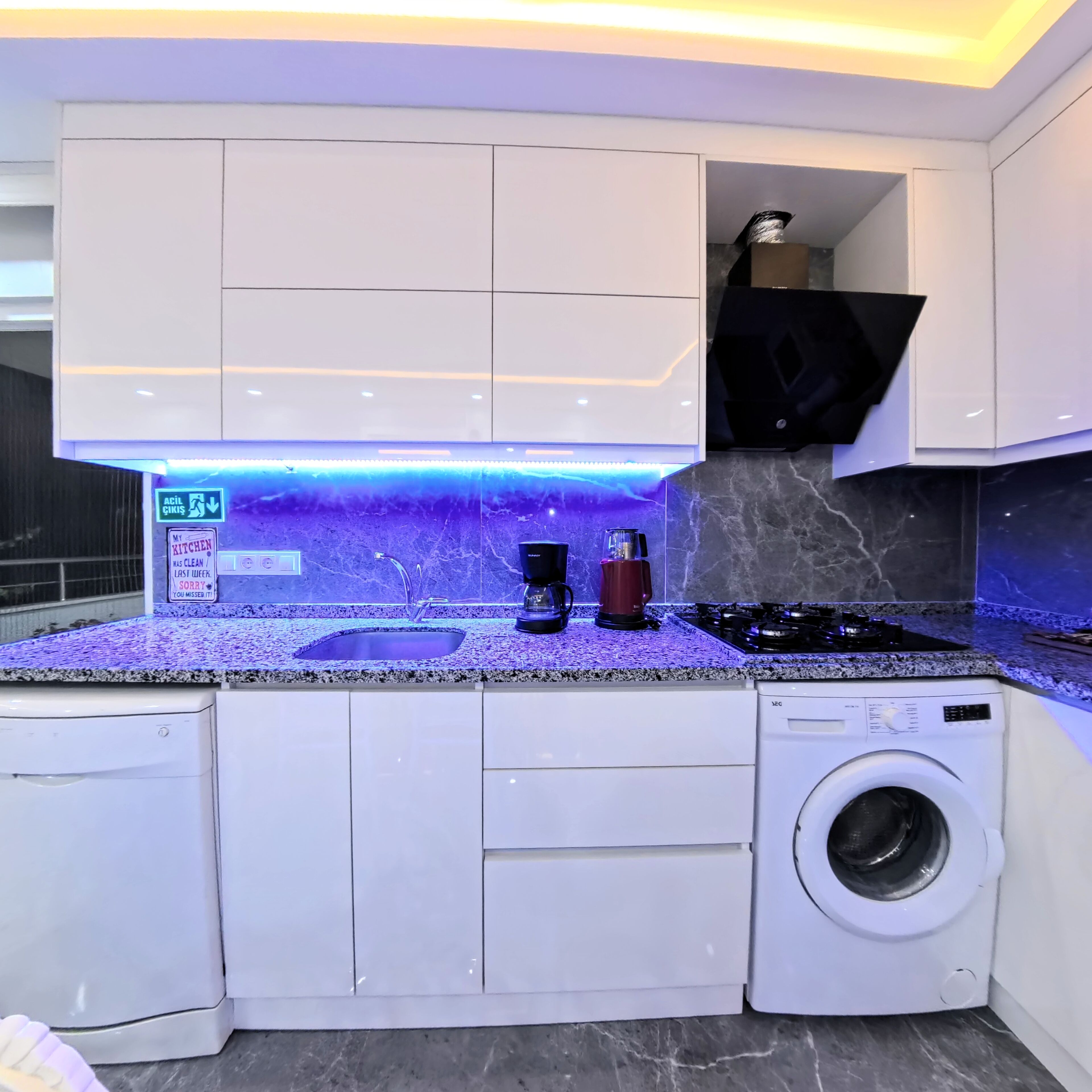 Family Condo, Balcony, City View | Private kitchen | Coffee/tea maker, cleaning supplies, paper towels