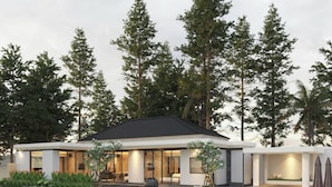 A modern house with a large glass facade, a swimming pool, and a well-maintained garden. - Guru Darma Villa Newly Built September 2025 (Taro)