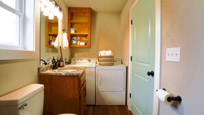 Shower, hair dryer, towels, toilet paper