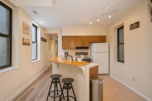 Fridge, microwave, oven, stovetop - Bright Soulard Loft-King-Queen, 2 Baths, Parking (St. Louis)