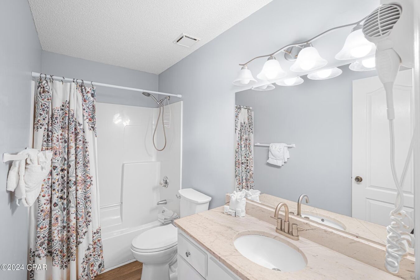 Hair dryer, towels, soap, toilet paper