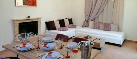 Basic Apartment, Patio, Sea View | Living area | Fireplace