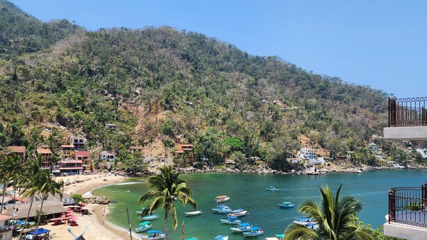 A coastal area with a beach, boats, and buildings. - 🎥✨ Imagine waking up to the sound of the sea, a cup of coffee on the terrace. (Puerto Vallarta)